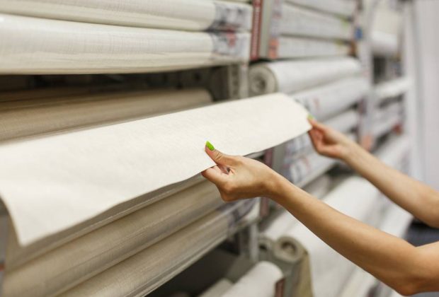 a-young-woman-in-a-hardware-store-buys-wallpaper-2026-03-17-14-39-48-utc